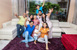 © GAJENDRRA BHATI  - Portrait of Happy cheerful indian family sitting together watching cricket match at home cheering and shouting for their team. sports and entertainment concept.