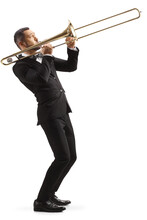 Full Length Profile Shot Of A Man In A Black Suit Playing A Trombone