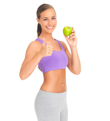 Canvas Print - Woman, studio portrait and apple with thumbs up for health, diet goal or wellness by white background. Isolated model, healthy fruit or smile for nutrition, vitamin c or natural detox for strong body