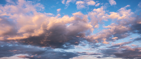 panoramic background of evening sky with dramatic stormy clouds