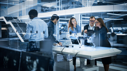 Fototapete - Professional Multicultural Team of Female and Male Engineers Use Industrial Programmable Robot Animal in a Factory Development Workshop. Tech Facility with Machines, Computers and Research Equipment.