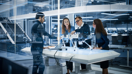 Leinwandbilder - Professional Multicultural Team of Female and Male Engineers Use Industrial Programmable Robot Animal in a Factory Development Workshop. Tech Facility with Machines, Computers and Research Equipment.