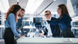 © Gorodenkoff - Portrait of a Young Team of Multicultural Engineers Use Computers, Connect Microchips, Analyze and Discuss How a Futuristic Robot Dog Works. High Tech Research Laboratory with Modern Equipment.