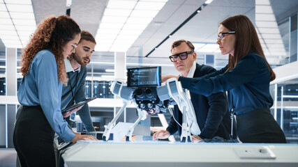 Leinwandbilder - Portrait of a Young Team of Multicultural Engineers Use Computers, Connect Microchips, Analyze and Discuss How a Futuristic Robot Dog Works. High Tech Research Laboratory with Modern Equipment.