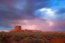 Lightning And Rock Formation Landscape At Sunset.