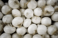 Heap Of White Onions For Sale At Market, Puglia, Italy