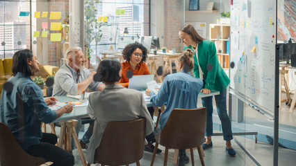 Poster - Female Chief Analyst Holds Meeting Presentation for a Team of Economists. She Shows a Whiteboard with Growth Analysis, Charts, Statistics and Data, Answers Questions. People Work in Creative Office