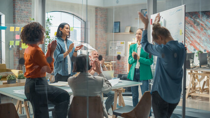 Poster - Woman Finishing a Presentation in a Meeting Room at Office With Multiethnic Team. She is Presenting Company Growth Data and Marketing Strategy. Colleagues Clapping, Cheering, Celebrating her Success.