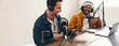 © Jacob Lund - Cheerful podcasters laughing and having a good time in a studio