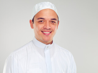 Portrait, muslim and religion with an islamic man in studio on a gray background for faith, belief in god or devotion. Eid, worship and ramadan with a male arab fasting in holy tradition or culture