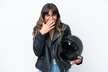 Wall Mural - Young caucasian woman with a motorcycle helmet isolated on white background happy and smiling covering mouth with hand