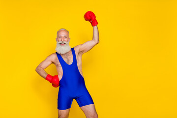 Sticker - Photo of funny strong man pensioner dressed blue overall red boxing gloves empty space isolated yellow color background