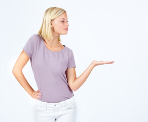 Poster - Woman, showing and hand for marketing space, advertising mock up and product placement mockup on studio background. Model, hand gesture and promotion for sales deal, logo branding and about us design