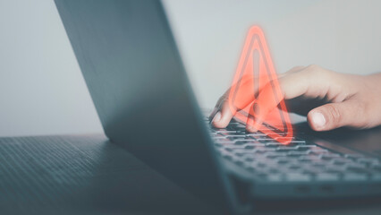 Triangle caution warning sign on laptop screen and Businessman or it staff , programmer, developer using computer for notification problem error 404 and maintenance concept.