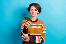 Photo Of Good Mood Gorgeous Woman With Short Hairstyle Dressed Striped Jumper Hold Phone Check Email Isolated On Blue Color Background
