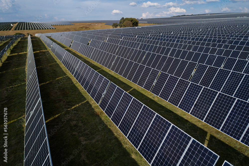 Large Solar Power Aerial view over a large solar energy farm for the supply of renewable ...