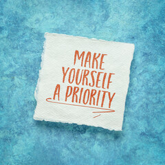 make yourself a priority -  inspirational advice or reminder, handwriting on an art paper, self care and personal development concept