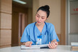 © Suriyo - Asian woman nurse working folder document in hospital