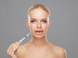 © Acronym - Beauty injection in a face of a young woman. Plastic surgery concept.
