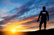 © hamara - Photojournalist silhouette documenting war or conflict. Photojournalist at sunset. War, army, technology and journalist work concept.
