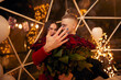 © verona_studio - Young couple is getting engaged. Romantic couples after proposal moment with a big bouquet of red roses