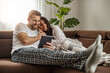 © ivanko80 - Couple using digital tablet at home