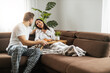 © ivanko80 - Young couple having breakfast in the living room
