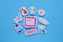 Woman`s Health. Different Paper Figures On Light Blue Background, Flat Lay
