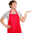 © Maridav - Apron man showing. Small business shop owner showing and looking wearing red apron. Happy smiling and proud Caucasian man presenting isolated in transparent PNG.