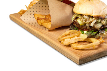 Sticker - Big hamburger, steak fries and onion rings on a wooden platter