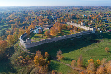 Wall Mural - View of the ancient Izborsk fortress on golden autumn (aerial view). Izborsk. Pskov region, Russia