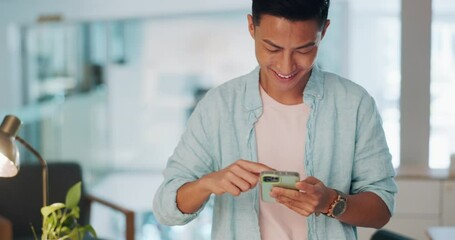 Poster - Phone, office and Asian man typing a message or networking on social media or mobile app. Technology, happy and male employee browsing the internet with a cellphone on a break in the workplace.