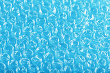 Packing Bubble Wrap For Parcels On A Blue Background In Full Screen