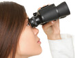 © Maridav - Closeup of young businesswoman looking through binoculars over white background. business woman in suit isolated in transparent PNG.