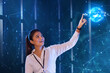 © IndiaPix - Female Technician touching on digital globe screen, future technology concept