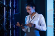 © IndiaPix - Female Technician/programmer working on the server in the data storage room