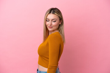 Wall Mural - Young caucasian woman isolated on pink background . Portrait