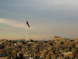 amman blue sky from citadel and jordan flag - jordan-Jan 2023