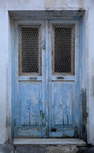 Old Wooden House Door Painted In Blue, Peeling Colour