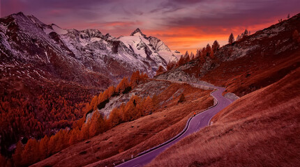 Fototapete - Incredible scenery of European Alps in during sunset. Grossglockner peak glowing in sunlight with perfect colorful sky. Grossglockner High Alpine  is a most popular place of travel.