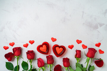 Wall Mural - Happy Valentine's day  background with heart shape candle and rose flowers. Top view, flat lay