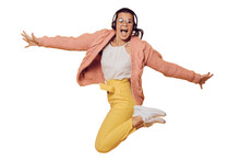 Excited Brunette Girl In Glasses Jumping, Listening Music In Headphones Spread Out Her Arms Dressed In Yellow Pants, White Shoes, Pink Sweater And Headphones On Her Head Over Transparent Background.