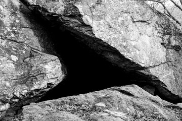 Cave entrance into darkness with no visible people