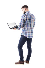 Wall Mural - Standing professional business man holding and using laptop computer with blank screen. Full body isolated on transparent background.