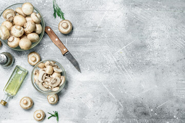 Poster - Sliced and whole mushrooms in bowl with knife.