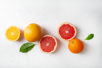 Wall Mural - Food background with sliced fruits top view orange grapefruit