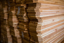 Stacks Of Wooden Planks Arranged In Workshop