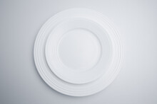 Overhead View Of Plates Over White Background
