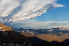 Lumpy Mammatus ("mammary") Clouds Build Over Distant Longs Peak And Rocky Mountain National Park, Colorado.