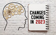 © Uladzislau - notebook with the word change is coming in 2023 on wooden background